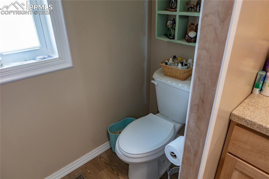 Image 20 of 50: Bathroom featuring vanity and wood finished floors