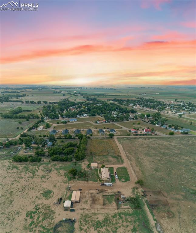 Image 8 of 50: Aerial view at dusk of a rural view
