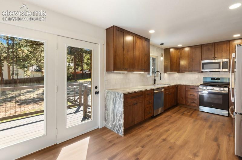 Image 8 of 26: Kitchen and Dining room