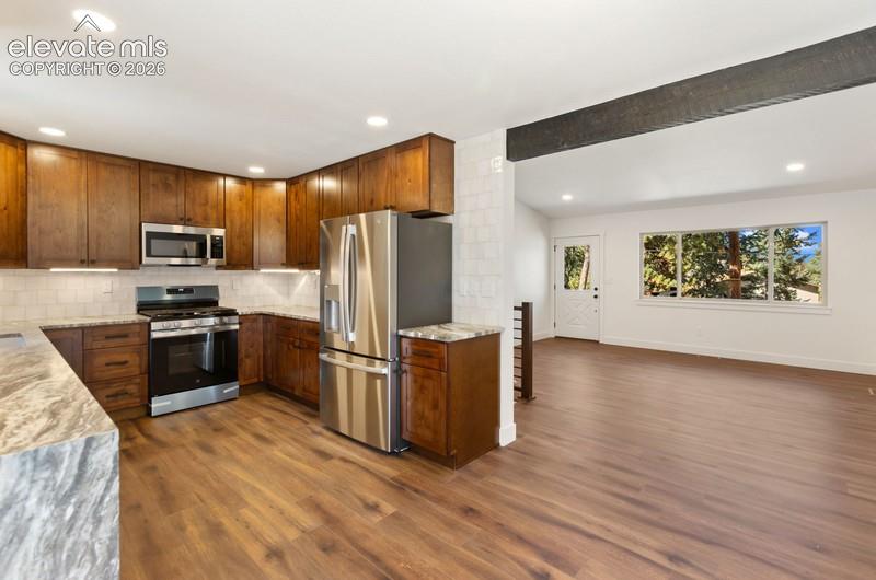 Image 9 of 26: Kitchen, dining and living room.