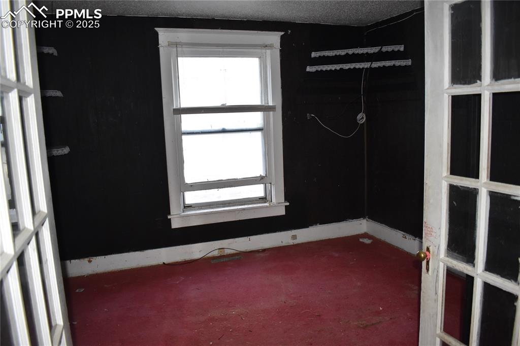 Image 14 of 23: Carpeted spare room featuring a textured ceiling