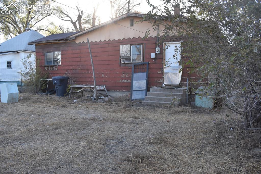 Image 6 of 23: Rear view of house with entry steps