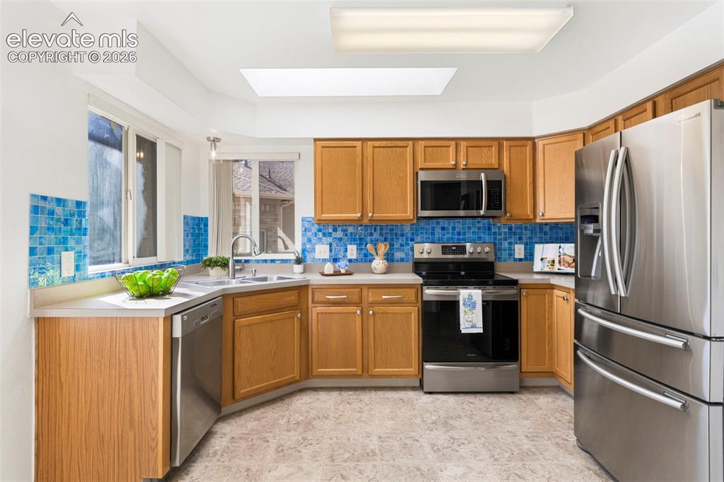 Image 13 of 50: Spacious kitchen with updated SS appliances