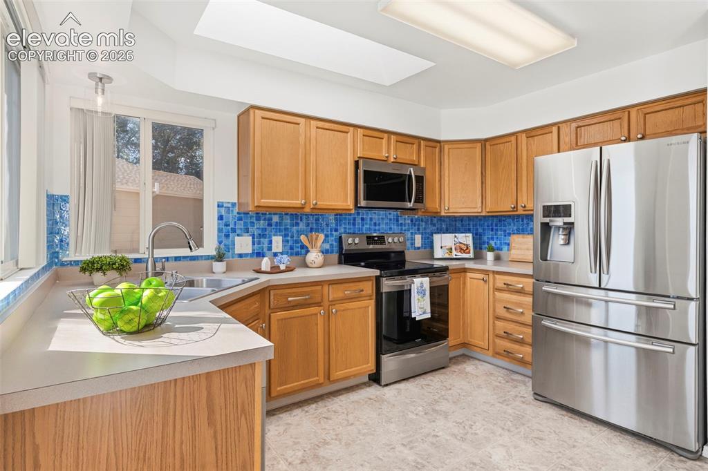 Image 14 of 50: Spacious kitchen with updated SS appliances