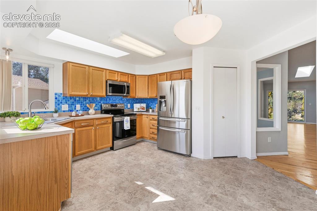 Image 15 of 50: Kitchen with a spacious breakfast nook area