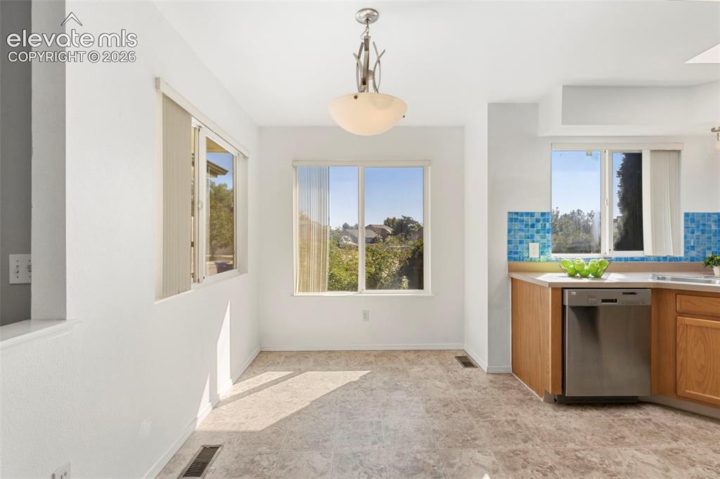 Image 17 of 50: Spacious breakfast nook area w/ lots of natural light
