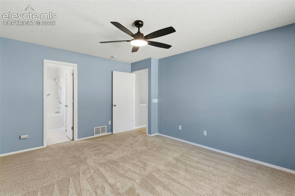 Image 22 of 50: Adjoining primary full bath & walk-in closet