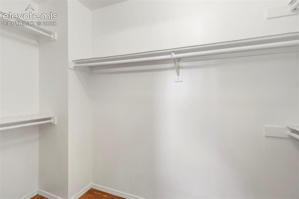 Image 24 of 50: Primary bedroom roomy walk-in closet
