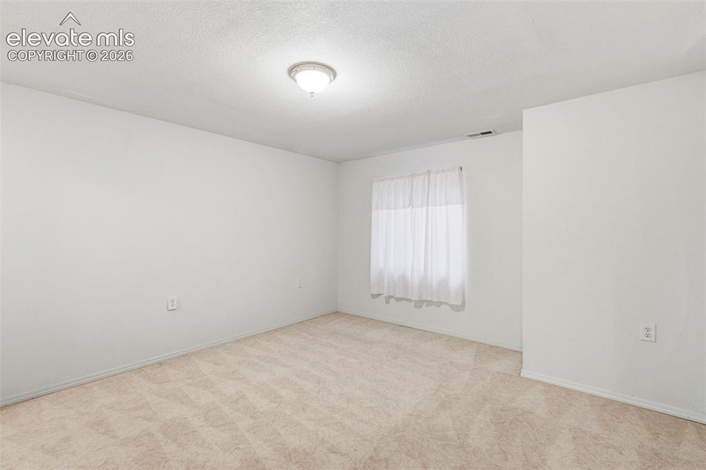 Image 31 of 50: Large basement bedroom w/ walk-in closet