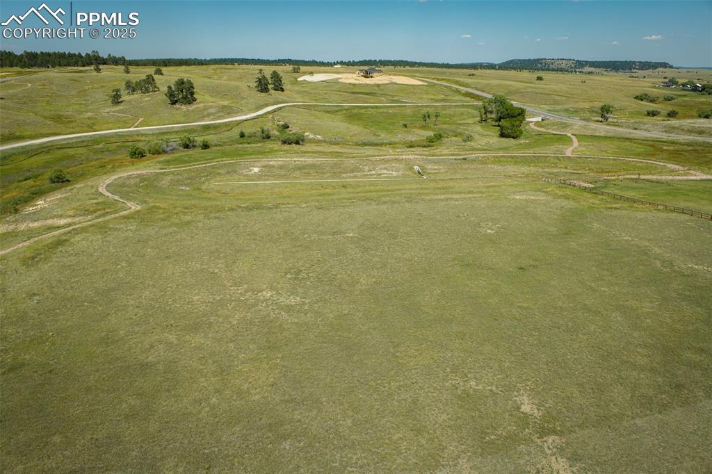 Image 14 of 17: Aerial view of property and surrounding area featuring rural landscape