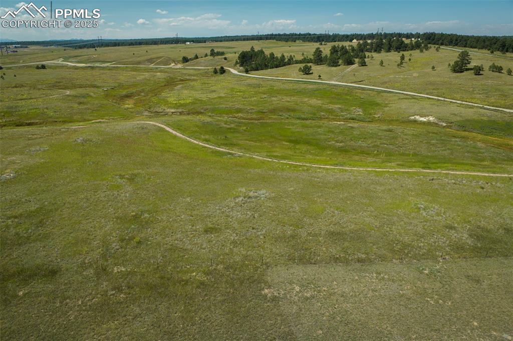 Image 3 of 17: Aerial view of property and surrounding area with rural landscape