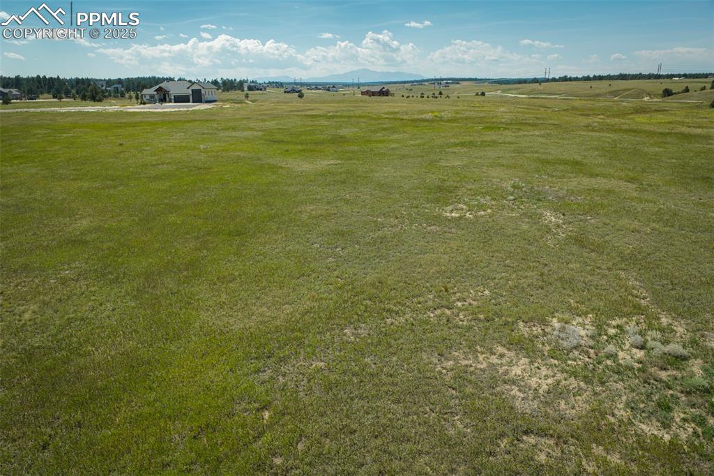 Image 8 of 17: View of yard with a rural view and a mountain view