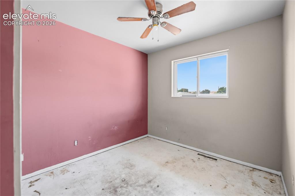 Image 11 of 31: Upper Level Bedroom #2 with ceiling fan.