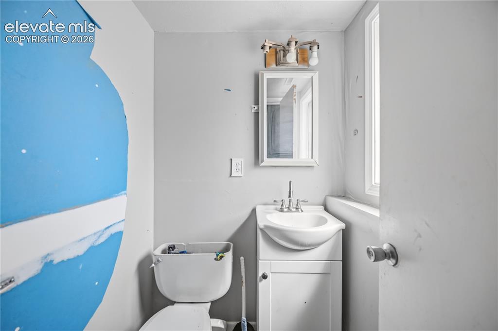 Image 21 of 31: Lower Level Powder Bathroom.
