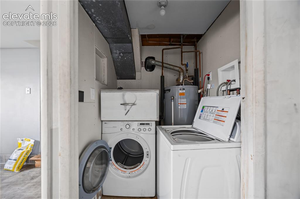 Image 22 of 31: Lower Level Laundry Room with washer and dryer.