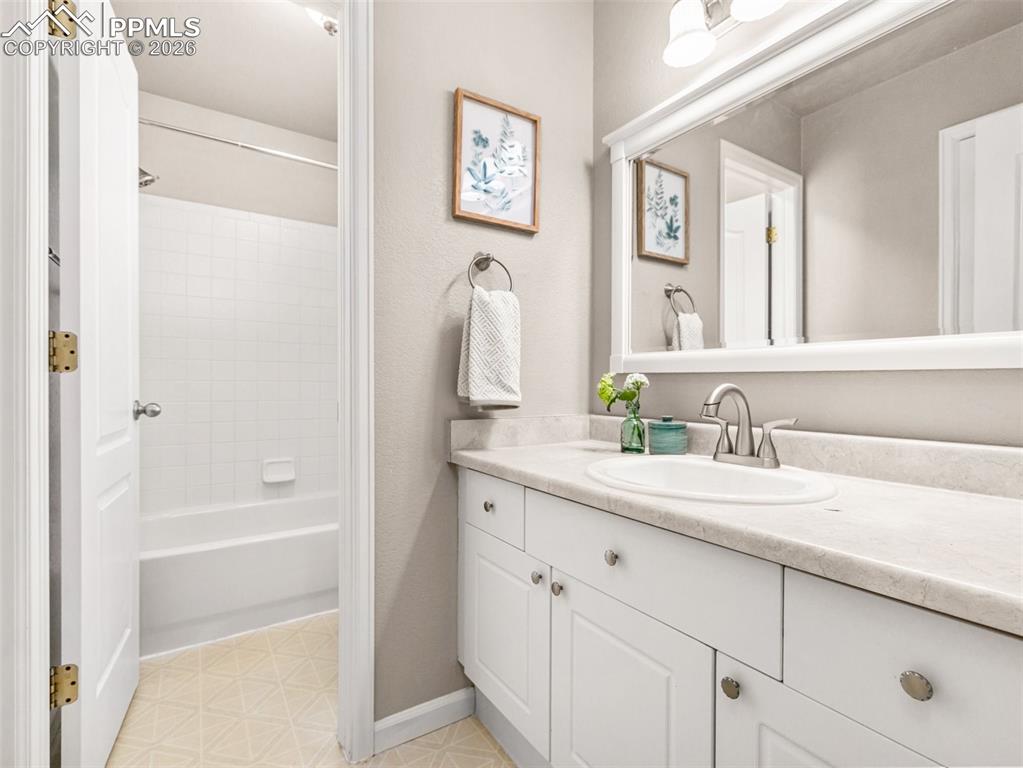 Image 14 of 23: Jack and Jill full bathroom shared with bedroom 2 and 3 