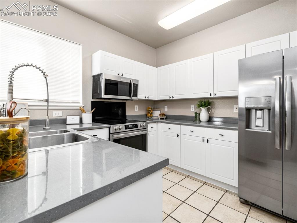 Image 6 of 23: Kitchen featuring stainless steel appliances,