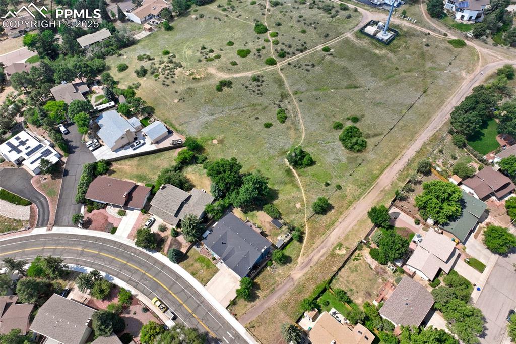 Image 2 of 49: Open area behind the property & Homestead Trail
