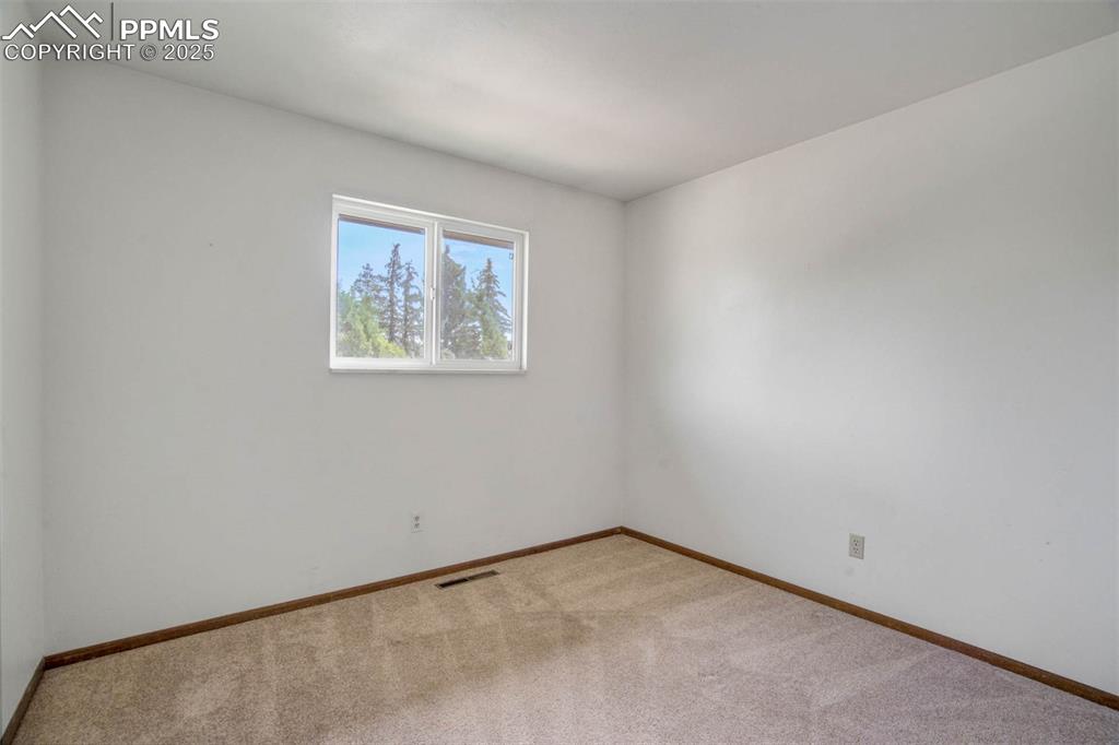 Image 23 of 49: 2nd bedroom-upper level