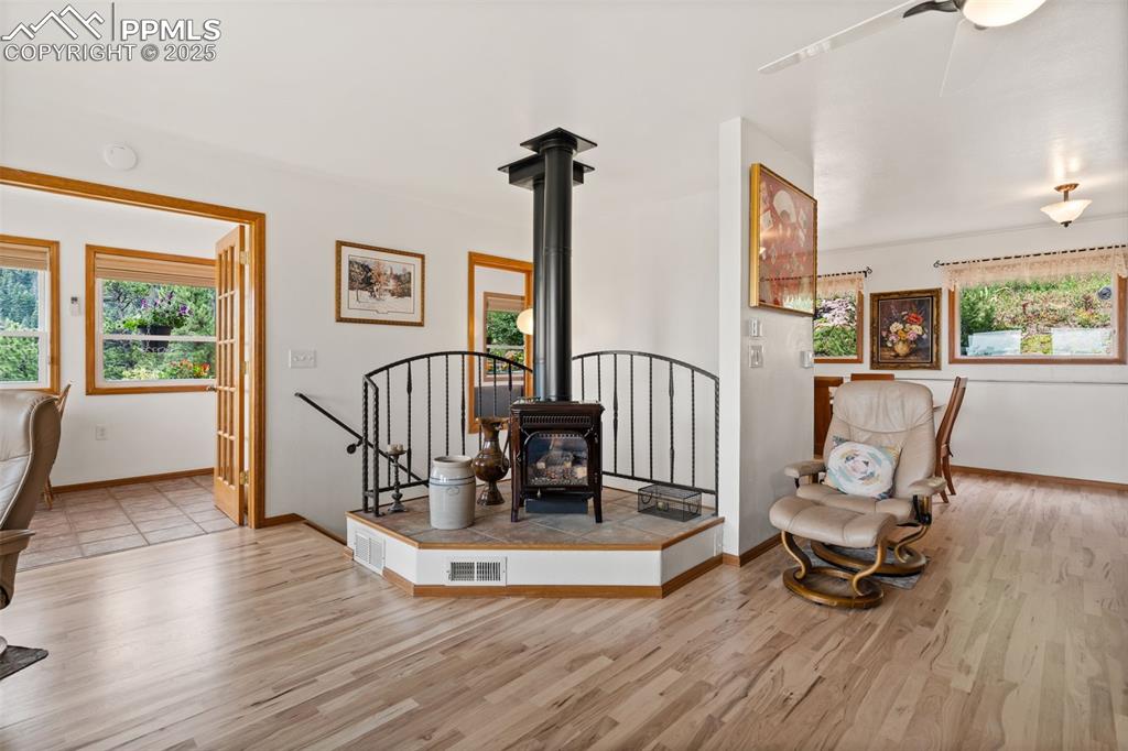 Image 15 of 45: Wrought Iron Railing around Gas Burning Stove!