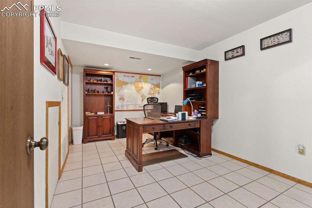 Image 33 of 45: Office/Craft Room with 12 x 12 Tile Flooring!