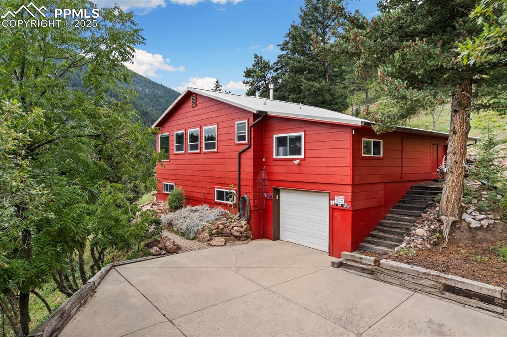 Image 8 of 45: Long Driveway to this Pristine Home!
