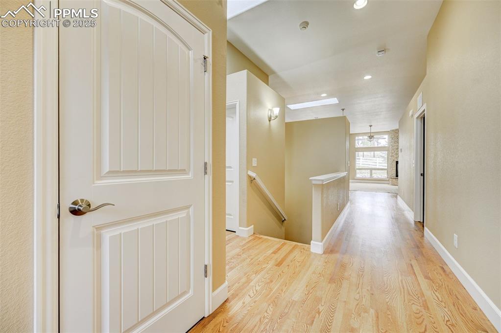 Image 4 of 30: Hallway featuring recessed lighting, light wood-style flooring, baseboards,