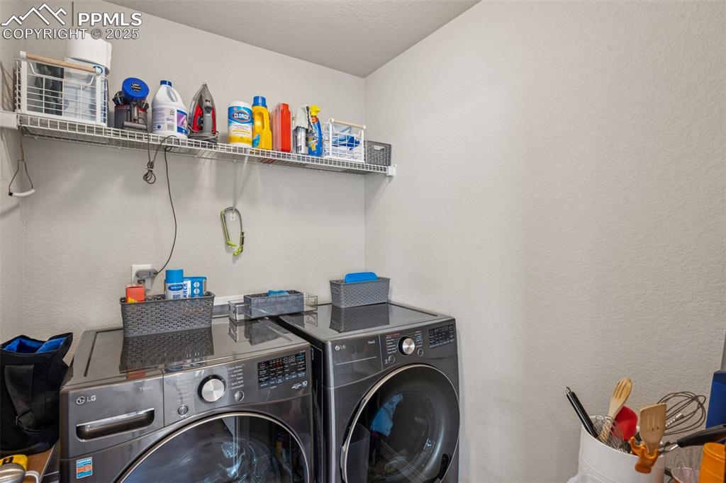 Image 21 of 29: Laundry room with independent washer and dryer