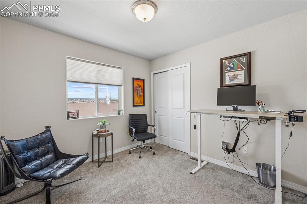Image 26 of 29: Carpeted office featuring baseboards