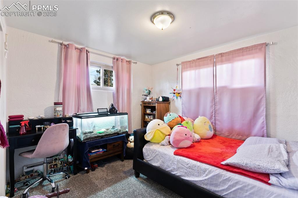 Image 12 of 49: Bedroom with carpet flooring