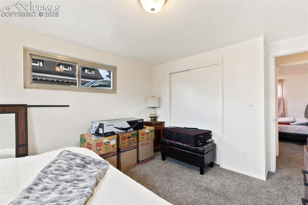 Image 14 of 49: Carpeted bedroom featuring a closet and baseboards