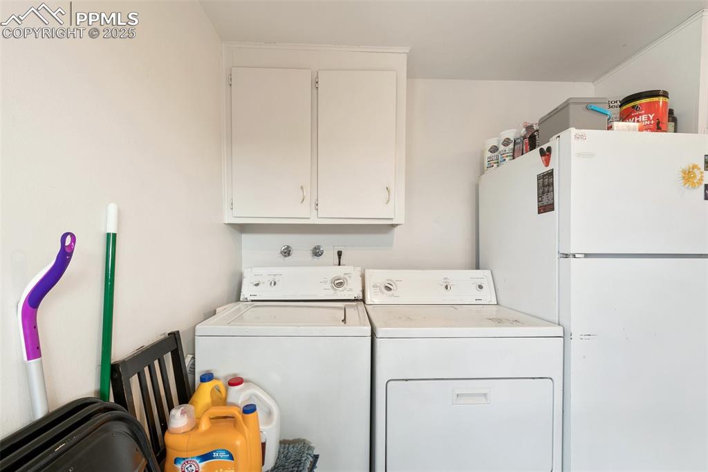 Image 30 of 49: Laundry area featuring separate washer and dryer