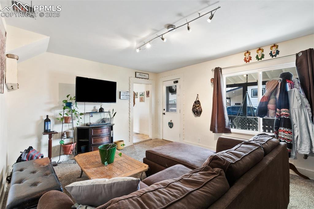 Image 35 of 49: Living room featuring visible vents and baseboards