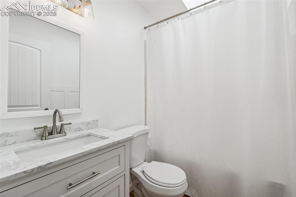 Image 17 of 22: Bathroom featuring toilet and vanity