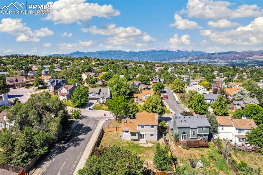 Image 20 of 22: Aerial view of residential area featuring mountains