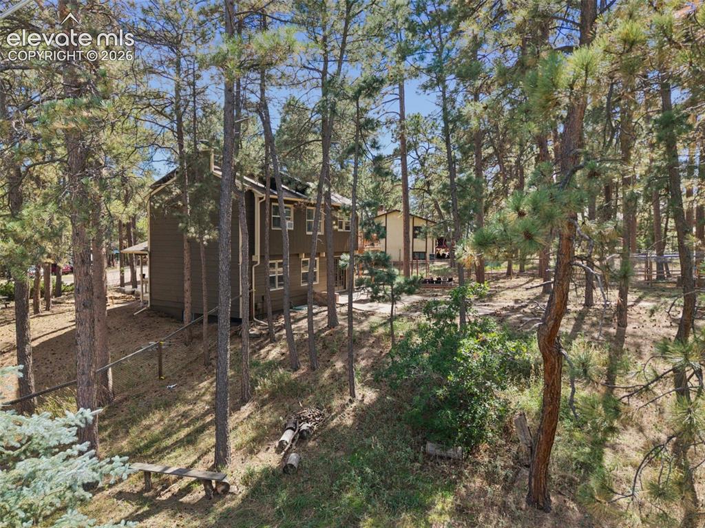 Image 10 of 40: Fenced backyard