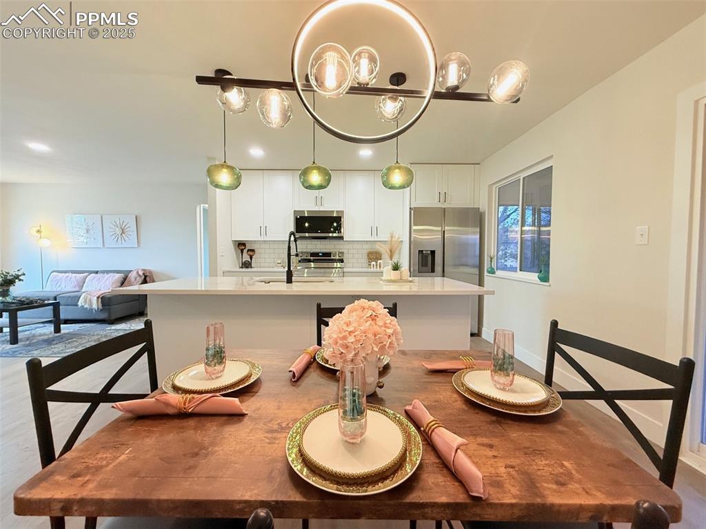 Image 17 of 50: Dining space featuring baseboards and recessed lighting