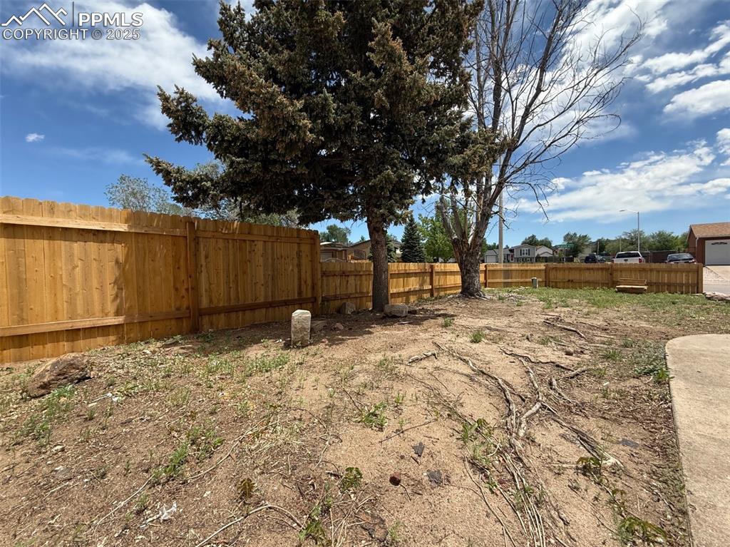 Image 49 of 50: View of fenced backyard