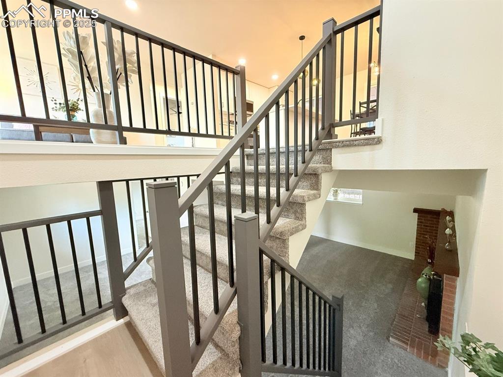 Image 5 of 50: Stairs featuring recessed lighting and carpet floors