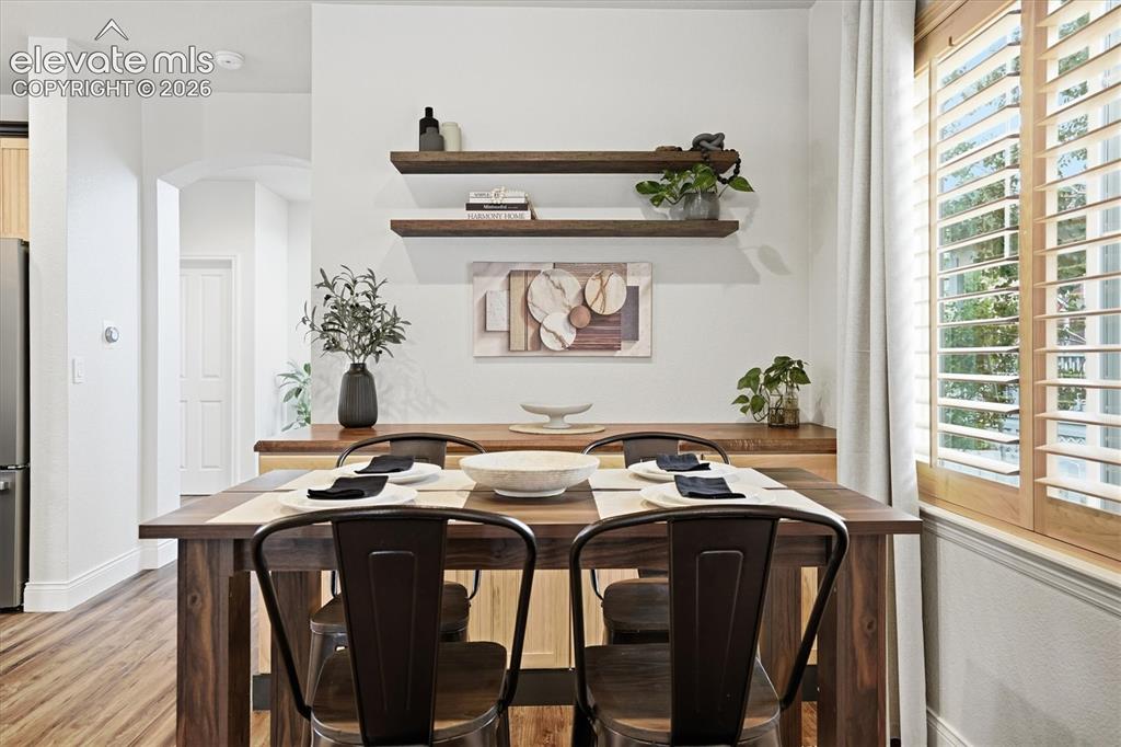 Image 16 of 50: Dining w/ built in additional storage