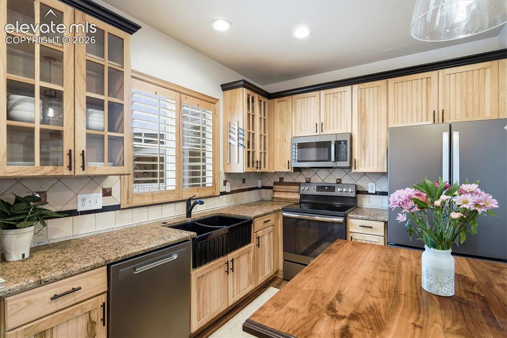 Image 3 of 50: Gorgeous updated Hickory cabinets + Farmhouse sink