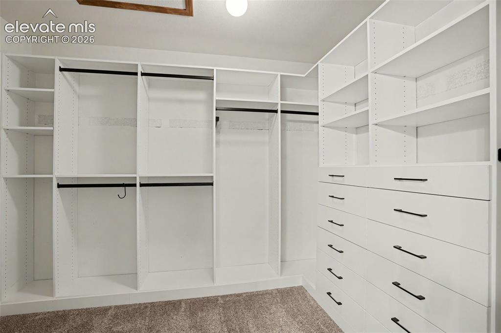 Image 21 of 40: Primary Bedroom Walk-in Closet