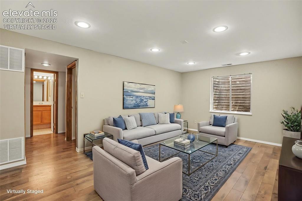 Image 25 of 40: Basement Family Room. Virtually Staged