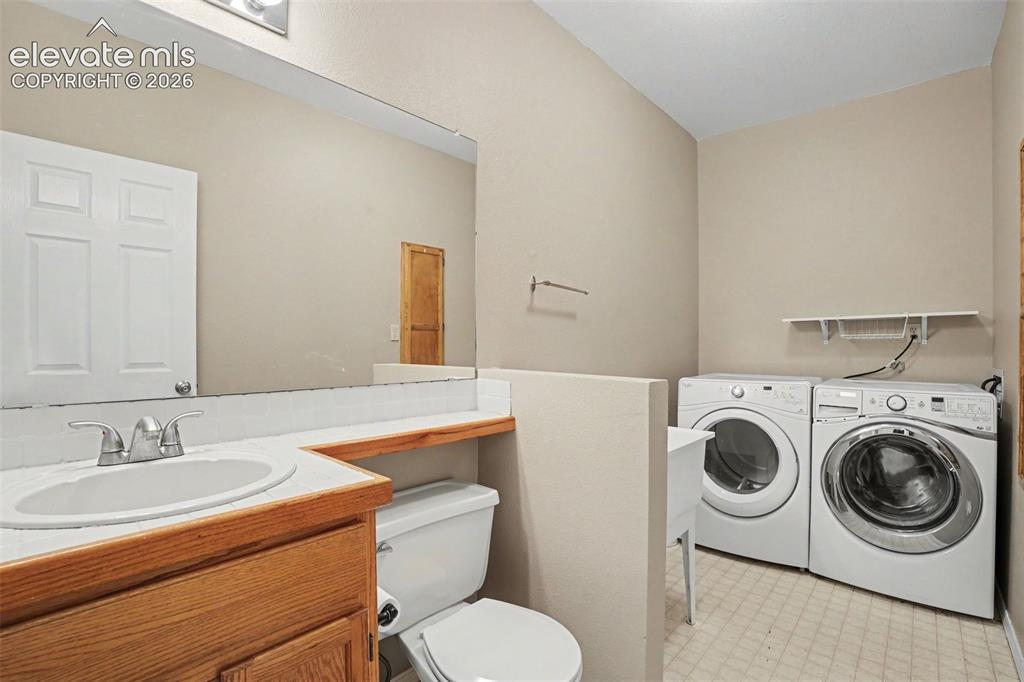 Image 30 of 40: Main Level Bathroom and Laundry
