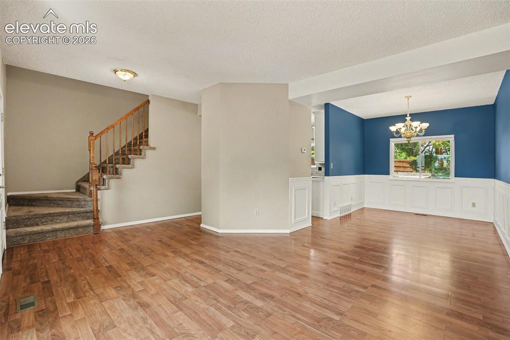 Image 7 of 40: Living Room and Dining Room