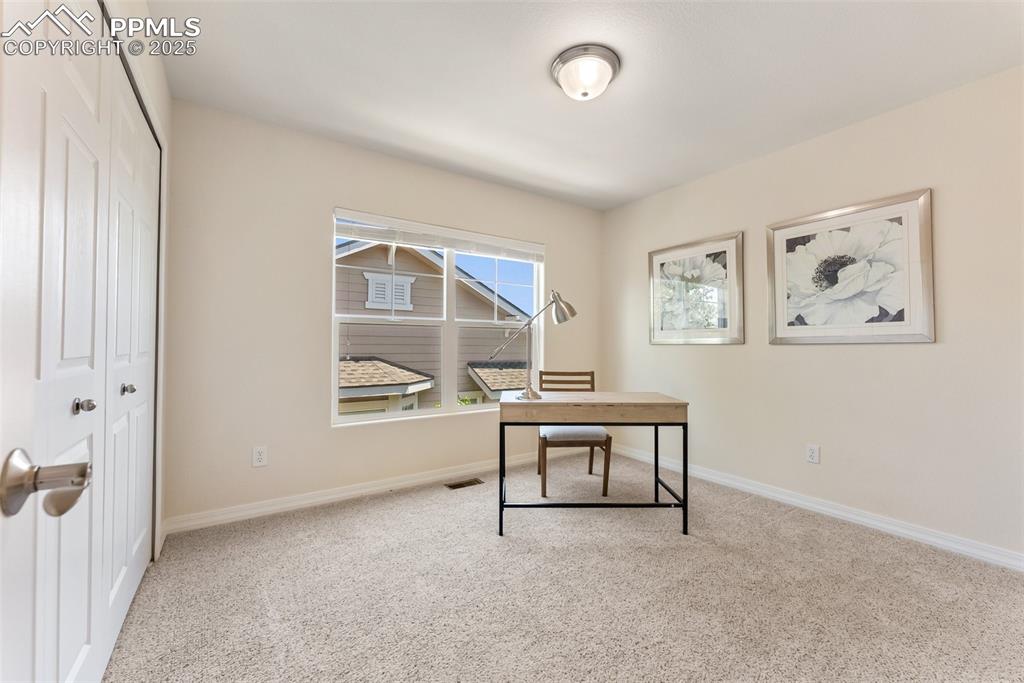 Image 14 of 48: Carpeted office featuring baseboards