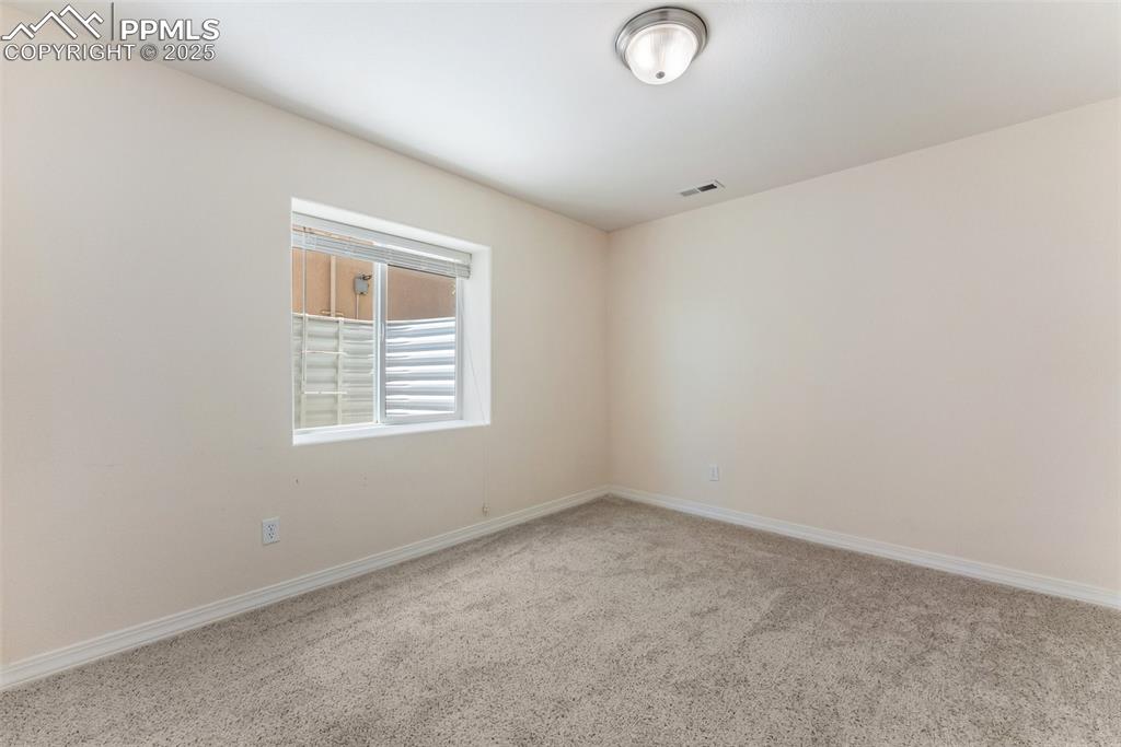 Image 35 of 48: Unfurnished room featuring carpet floors and baseboards
