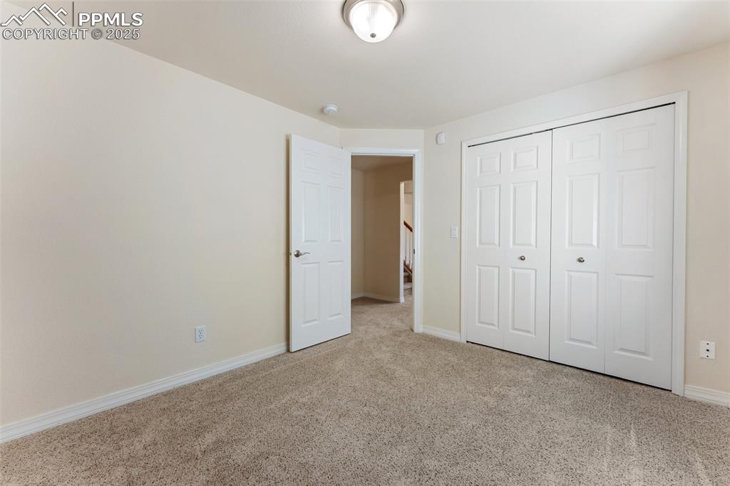 Image 37 of 48: Unfurnished bedroom with carpet floors and a closet
