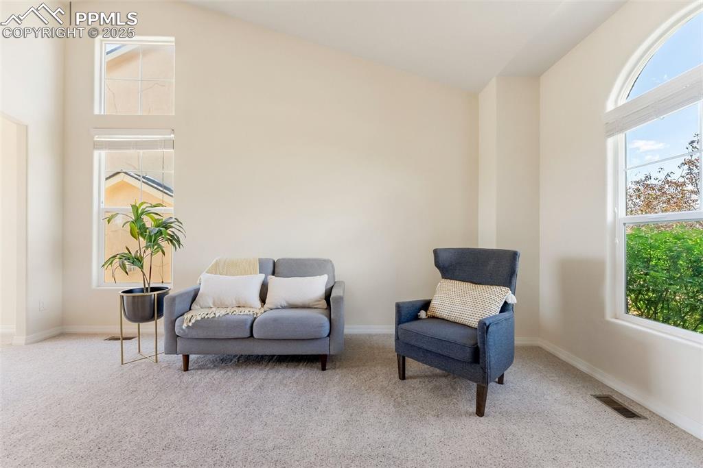 Image 5 of 48: Sitting room featuring carpet flooring and lofted ceiling