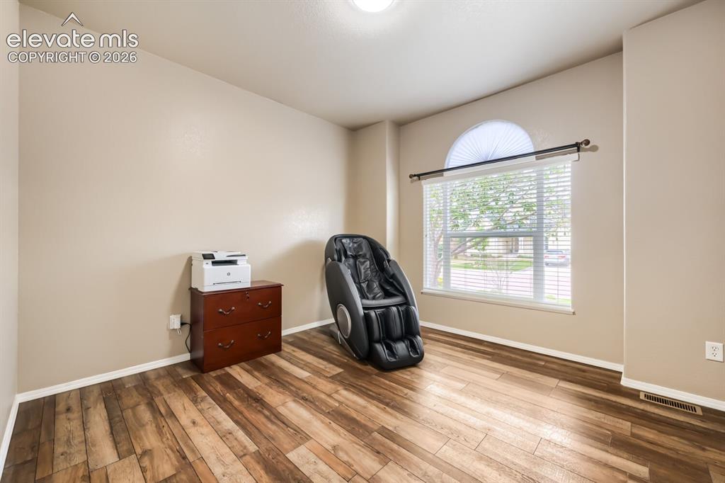 Image 16 of 30: main level bedroom/office